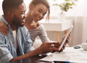 Couple looking at houses on ipad
