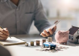 homeowner calculating whether to rent or sell house