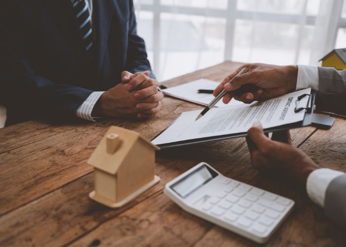 Guarantor rental contract being signed