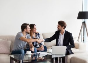 Agent showing couple around at property